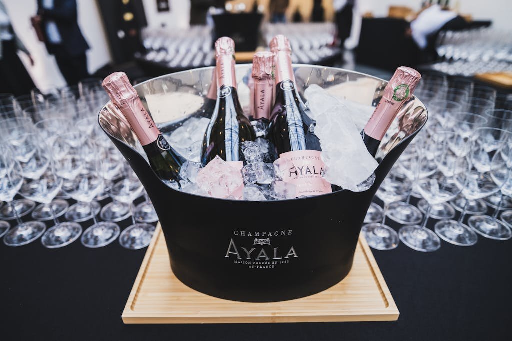 Elegant display of Ayala Champagne bottles chilled in ice bucket, perfect for Parisian events.
